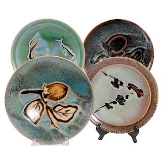 Four Japanese art pottery plates.