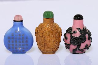 Three Chinese Peking glass snuff bottles.