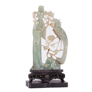 Chinese jadeite carving on stand.