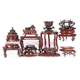 Collection of twenty Chinese stands and lids.