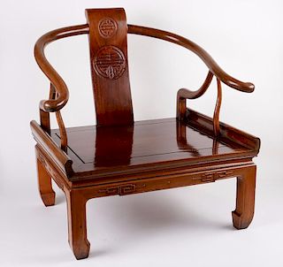 a Chinese horseshoe armchair.