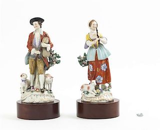 A Pair of Continental Porcelain Figures, Height of porcelain 10 inches.