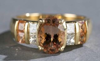2 ct+ golden topaz, diamond, and 18kt gold ring.