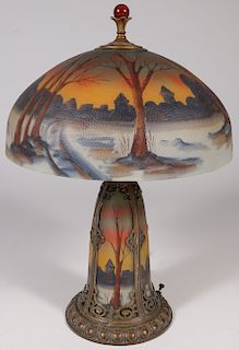 A REVERSE PAINTED LAMP WITH LIGHTHOUSE BASE