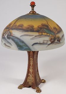 A REVERSE PAINTED LAMPSHADE AND BASE