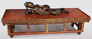 A CARVED AND GILT WOOD RECLINING BUDDHA
