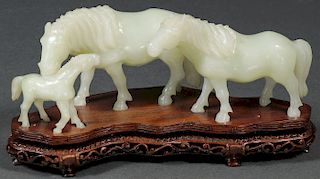 A CHINESE CARVED JADE HORSE FIGURAL GROUPING
