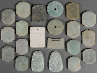 A GROUP OF TWENTY CHINESE CARVED JADE PENDANTS