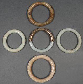 FIVE CHINESE CARVED BANGLES