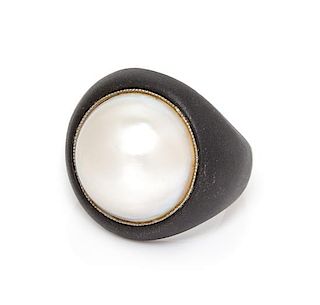 * An Art Moderne Blackened Steel, Platinum and Cultured Mabe Pearl Ring, Marsh & Co., 9.90 dwts.