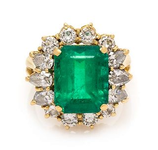 An 18 Karat Yellow Gold, Emerald and Diamond Ring, 7.60 dwts.