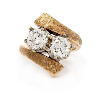 A Bicolor Gold and Diamond Bypass Ring, 4.55 dwts.