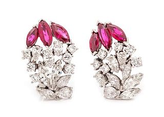 A Pair of White Gold, Diamond and Ruby Earclips, 7.65 dwts.