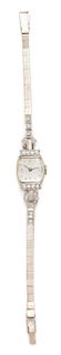 A Palladium, 14 Karat White Gold and Diamond Wristwatch, Tiffany & Co., 10.34 dwts.