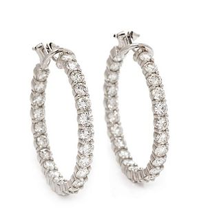 A Pair of White Gold and Diamond Hoop Earclips, 9.70 dwts.