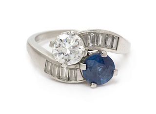 A Platinum, Diamond and Sapphire 'Toi et Moi' Ring, 5.35 dwts.