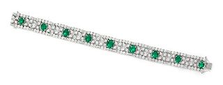 An 18 Karat Bicolor Gold, Emerald and Diamond Bracelet, 26.25 dwts.
