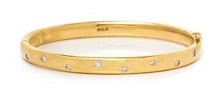 An 18 Karat Yellow Gold and Diamond Bangle Bracelet, 27.70 dwts.