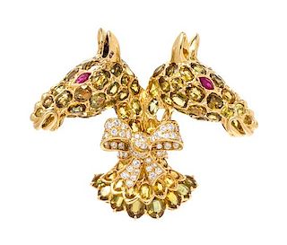 An 18 Karat Yellow Gold, Sapphire, Ruby and Diamond Twin Horse Head Brooch, Tiffany & Co., 30.90 dwts.