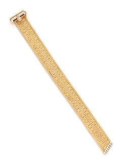 A 14 Karat Bicolor Gold and Diamond Belt Motif Bracelet, Hammerman Brothers, 30.40 dwts.