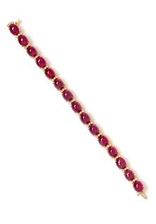 A Yellow Gold, Ruby and Diamond Line Bracelet, 16.80 dwts.