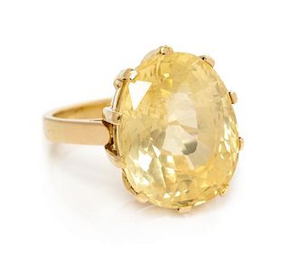 An 18 Karat Yellow Gold and Yellow Sapphire Ring, 7.35 dwts.
