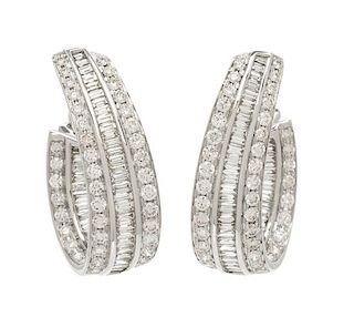 A Pair of 18 Karat White Gold and Diamond Hoop Earclips, 13.30 dwts.