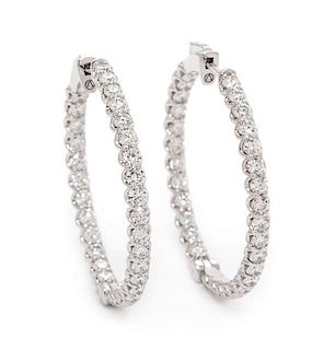 A Pair of 14 Karat White Gold and Diamond Hoop Earrings, 6.90 dwts.