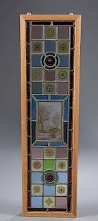 Framed antique stained glass window.