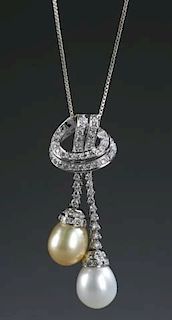 Baroque double drop pearl and diamond necklace.