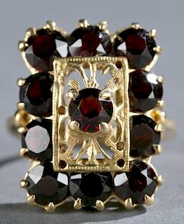 Garnet and 14kt yellow gold shield ring.