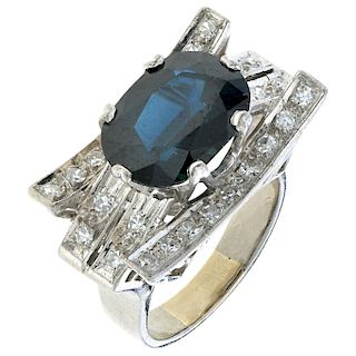A sapphire and diamond 14K white gold and palladium silver ring.