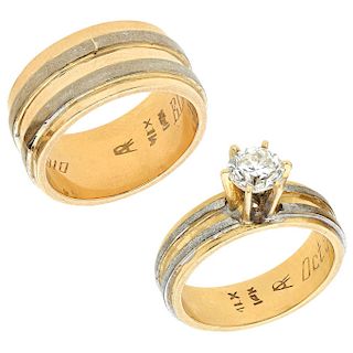 A 14K yellow and white gold wedding and solitaire ring set.