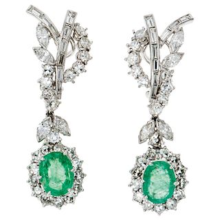 A pair of emerald and diamond palladium silver earrings.