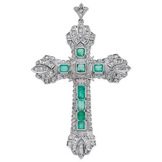 An emerald and diamond palladium silver cross pendant.