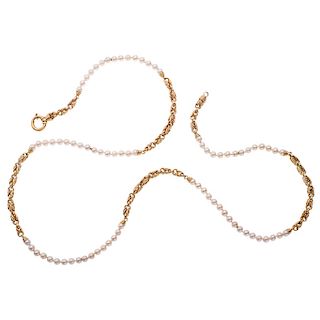 A cultured pearl and 14K yellow gold necklace.