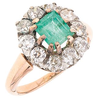 An emerald and diamond 18K rose gold ring.