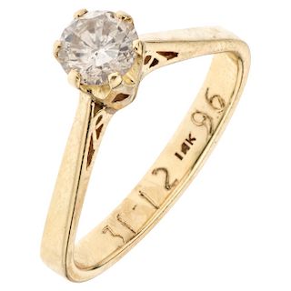 A 14K yellow gold solitaire ring.