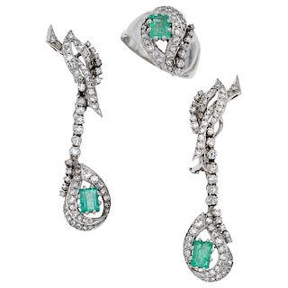 An emerald and diamond palladium silver ring and pair of earrings set. 