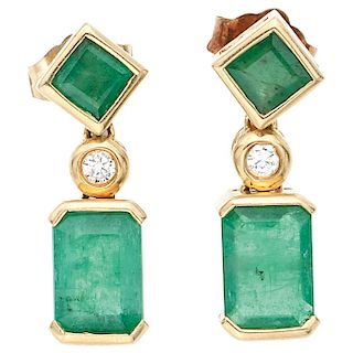 A pair of emerald and diamond 14K and 10K yellow gold earrings.