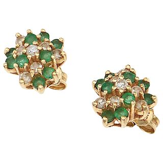 A pair of emerald and diamond 14K yellow gold stud earrings.