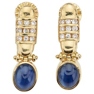 A pair of sapphire and diamond 18K yellow gold earrings.