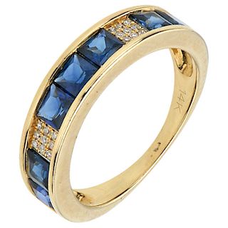 A sapphire and diamond 14K yellow gold ring.