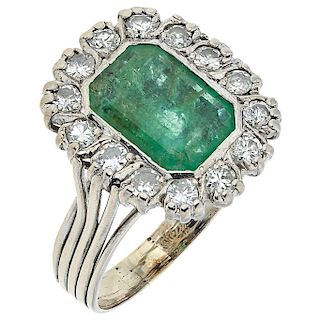 An emerald and diamond palladium silver ring.