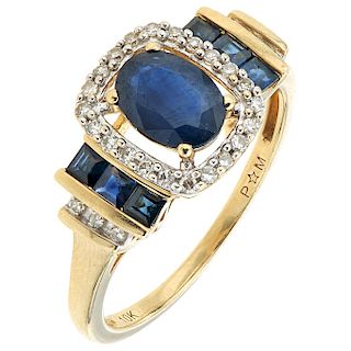 A sapphire and diamond 10K yellow gold ring.