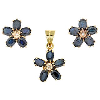 A sapphire and diamond 14K yellow gold pendant and stud earrings set.