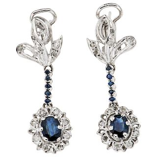 A pair of sapphire and diamond palladium silver earrings.