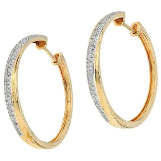 BIZZARRO diamond 14K yellow gold pair of hoop earrings.