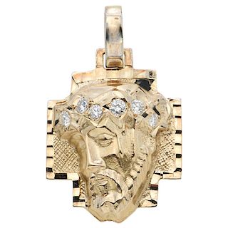 A diamond 14K yellow gold religious pendant.