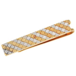 An 18K platinum and 18K yellow gold tie clip.